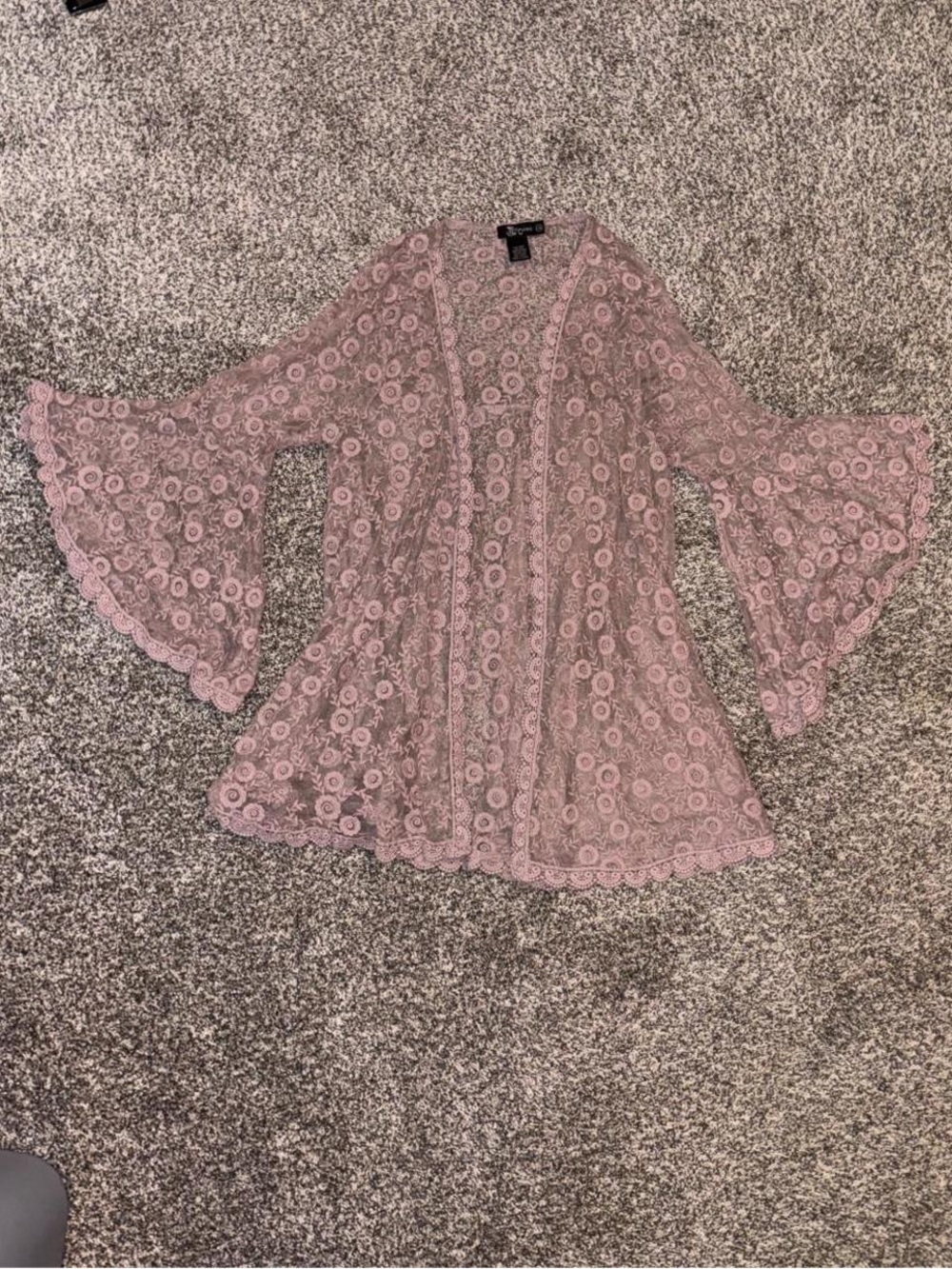 Pink lace cardigan with a whimsical floral design
